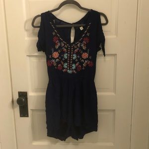 Francescas navy romper with flower detailing